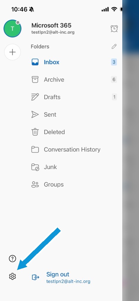 The folder menu with an arrow pointing to the gear